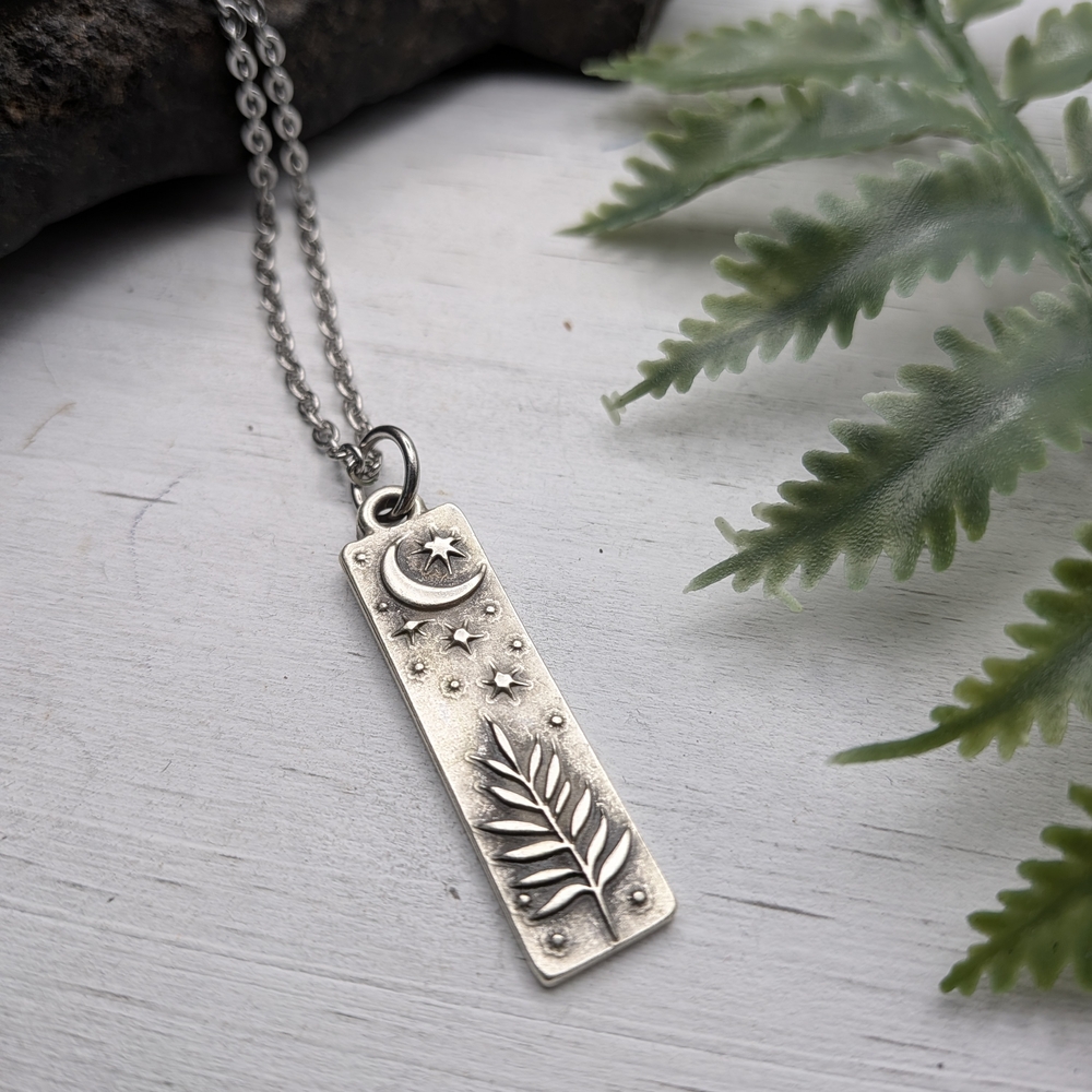 Silver Pendant Necklace with Moon and Leaf Design